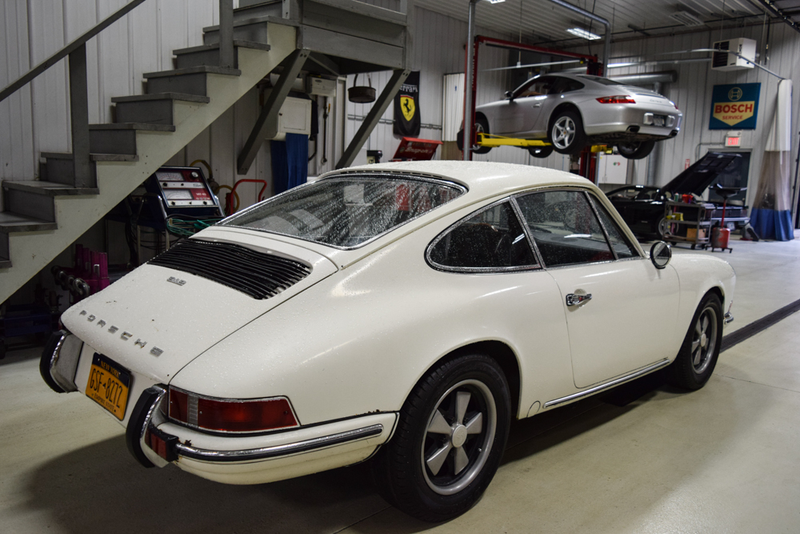 Watching the downpour with a 912 we’re preparing for daily driver duties and a 997 about to go in the show room.